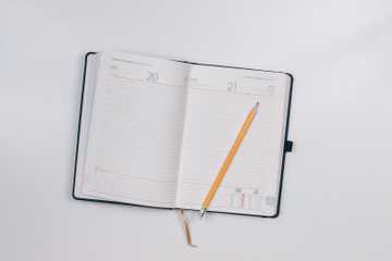 pencil on opened notebook